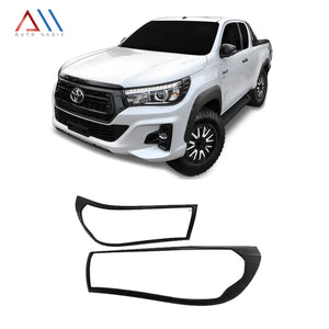Marcos de faros Hilux 16-19